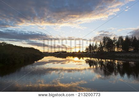 Sunset over a river in autumn Vaga