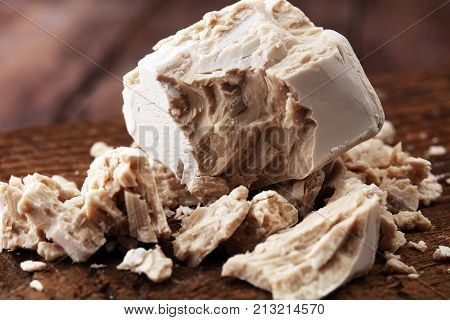 Dry yeast crumbled and yeast block for baking.