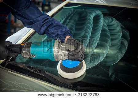 Man Polishes The Front Glass