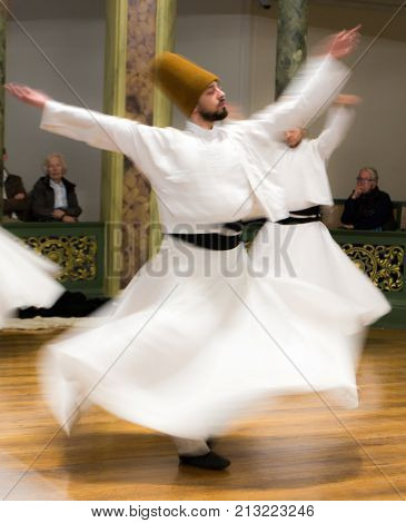 Blurred Whirling Dervishes Practice Their Dance
