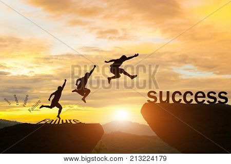 Men jump over silhouette failure Committed to success.