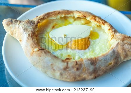 Adjarian Khachapuri With Eggs On The Table