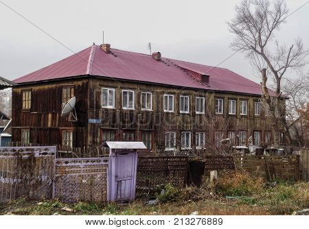 Kazakhstan, Ust-kamenogorsk, november 2, 2017: Old wooden house. Apartment building on Filatova street in the area of Zashchita