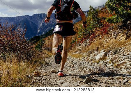 Crimea Russia - October 13 2017: back man athlete runner running on mountain trail during Crimea Х Run