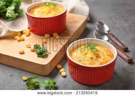 Ramekins with corn pudding on table