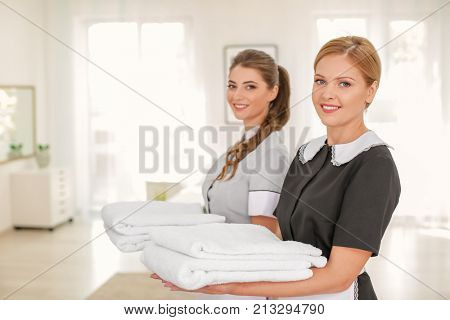 Beautiful chambermaids in room