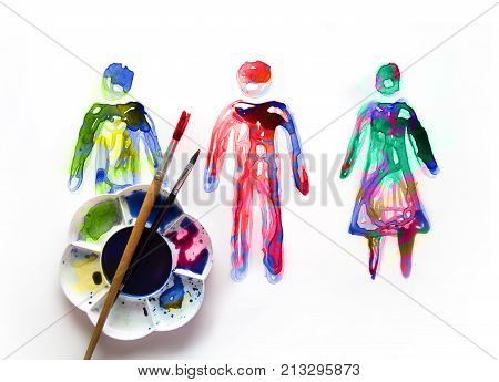 Abstract people made of watercolour  palette and artist brushes