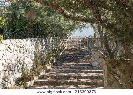 Natural stone steps go upstairs in the park