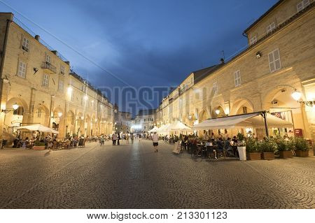 FERMO, ITALY - JULY 9, 2017: Fermo (Marches Italy): historic buildings along the historic main square of the city at evening. People