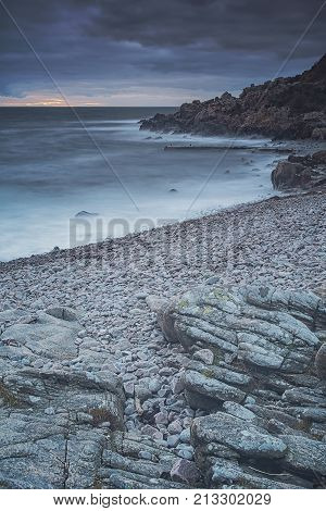 Rocky beach landscape at dusk. Kullaberg Sweden.