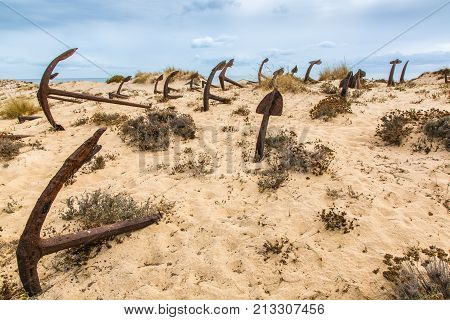 Natural Cemetery Of Marine Anchors At Barril Beach, Portugal