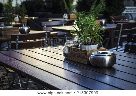 Table and items in a cozy European cafe close-up.