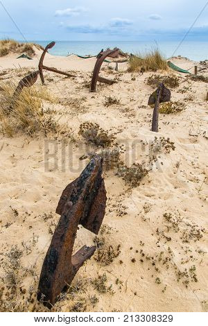 Natural Cemetery Of Marine Anchors At Barril Beach, Portugal