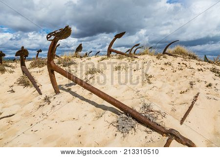 Natural Cemetery Of Marine Anchors At Barril Beach, Portugal