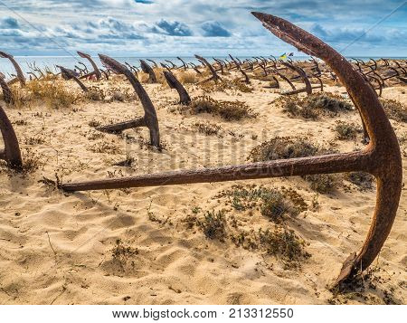 Natural Cemetery Of Marine Anchors At Barril Beach, Portugal