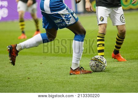 SOLNA SWEDEN - OCT 30 2017: Closeup of legs of soccer players fighting to get the ball in the game AIK and IFK Gothenburg. October 30 2017SolnaSweden