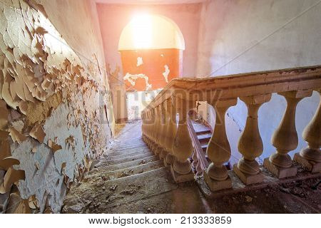 Old vintage staircase in abandoned mansion in Voronezh.