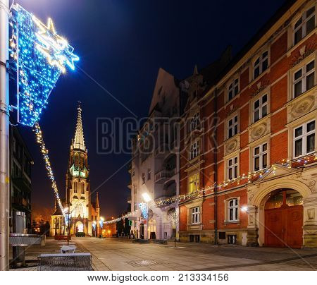 Mariacki church with angel in christmas night. Katowice Poland. Europe.