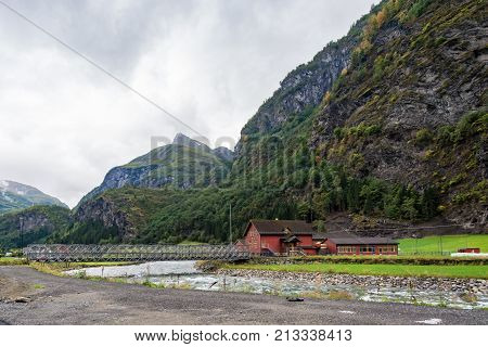 Flam is a village in Flamsdalen at the inner end of the Aurlandsfjorden a branch of Sognefjorden. The village is located in the municipality of Aurland in Sogn og Fjordane county Norway.
