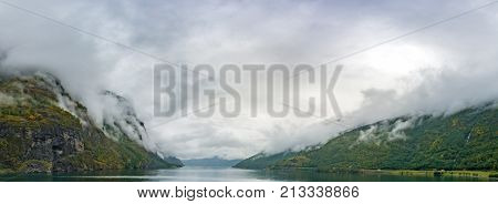 Flam is a village in Flamsdalen at the inner end of the Aurlandsfjorden a branch of Sognefjorden. The village is located in the municipality of Aurland in Sogn og Fjordane county Norway.