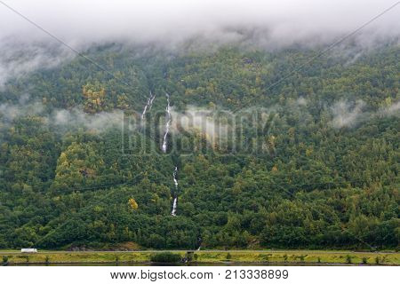 Flam is a village in Flamsdalen at the inner end of the Aurlandsfjorden a branch of Sognefjorden. The village is located in the municipality of Aurland in Sogn og Fjordane county Norway.