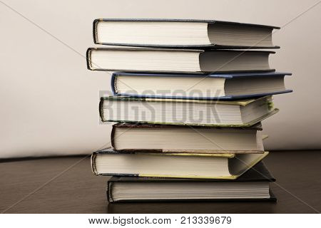 stack of old books on a table to the library.