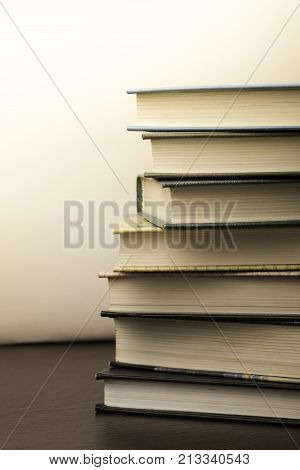 stack of old books on a table to the library.