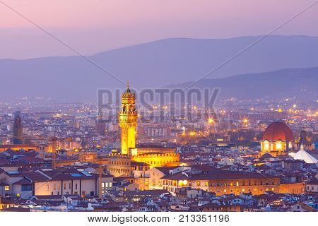 Famous Arnolfo tower of Palazzo Vecchio on the Piazza della Signoria at beautiful sunset in Florence, Tuscany, Italy