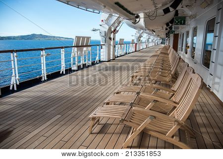 NADI, FIJI, PACIFIC ISLANDS-NOVEMBER 27TH, 2016: Noordam cruise ship deck with lounge chairs and scenic Pacific Island views in Nadi, Fiji, Pacific Islands