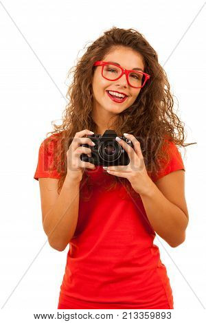 Woman in red holding a retro camera isolated ovr white background