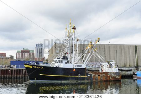 New Bedford Massachusetts USA - November 12 2017: Commercial fishing vessel Norseman docked in New Bedford harbor