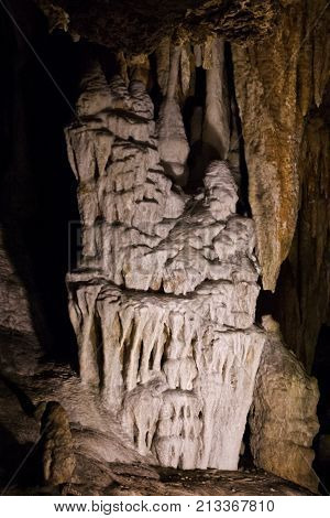 Vertical view of the amazing cavern speleothems mostly stalactite stalagmite formations with warm lighting at the Luray Caverns, Virginia located in the Shenandoah Valley.