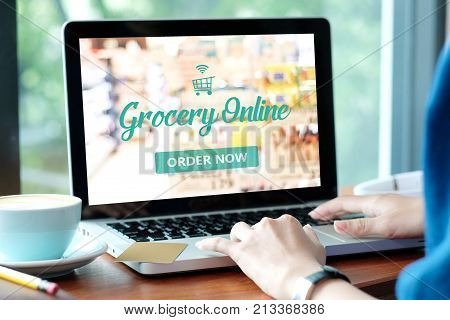 Woman hands typing laptop computer with grocery shopping online onscreen background business and technology lifestyle concept