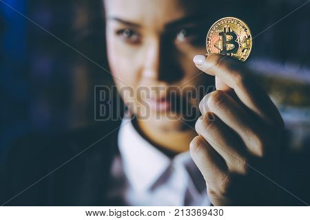 coin bitcoin cryptocurrency hold hand blured female