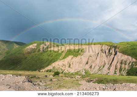 Mountain landscape with a rainbow (hill, rainbow)