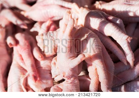 Chicken legs in sunlight in a chinese market