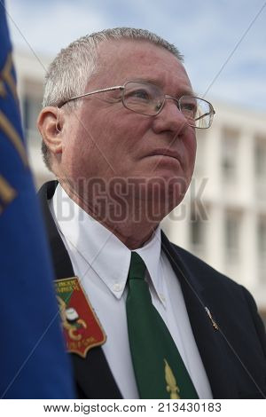 Aubagne, France. May 11, 2012. Portrait of a veteran of the French foreign legion with the banner of veterans of the foreign legion during the annual meeting of veterans.