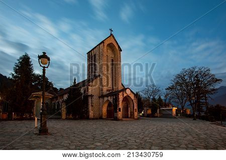 ancient stone church of sapa with blue night sky most popular traveling destination in sapa norhtern of vietnam
