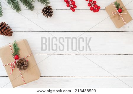 Christmas background - Christmas present gifts boxes with decoration on white wooden background. Creative Flat layout and top view composition with border and copy space design.
