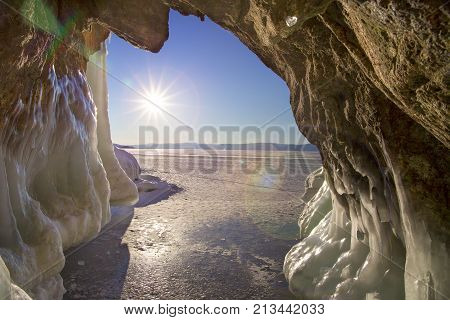 The View From The Grotto With Icicles, Chunks Of Ice And Hummocks To The Sun And Blye Sky. Natural B