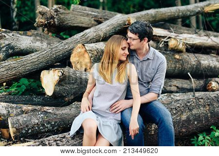 Boyfriend and girlfriend, loving couple walking and kissing at sunset in rural mestres on nature 1