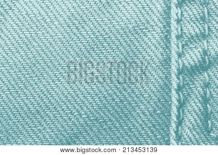 Light blue jeans texture. Denim jeans texture, denim jeans background with a seam. Jeans fashion design. Horizontal