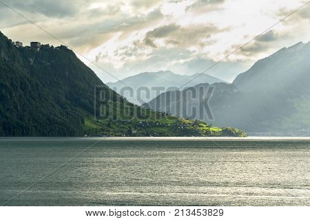 View of lake Lucerne in the evening, as seen from Weggis, Switzerland. Mount Pilatus on the right.