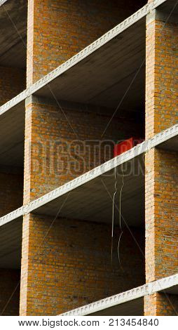 Floors. Fragment of the wall of the unfinished building.