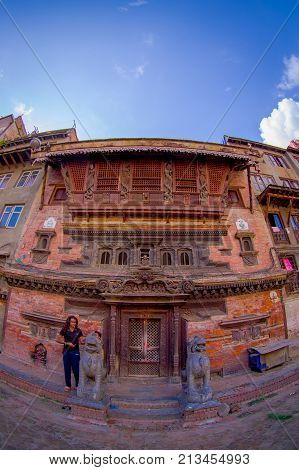 KATHMANDU, NEPAL OCTOBER 15, 2017: A building facade with brick wall of the historical building near Patan Durbar Square, Kathmandu, Nepal.