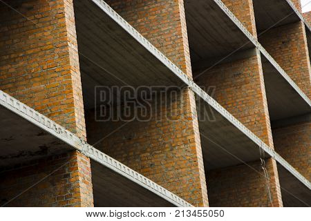 Floors. Fragment of the wall of the unfinished building.