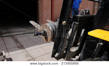 Forklift Driver In Protective Vest Driving Forklift At Warehouse Of Freight Forwarding Company. Man 