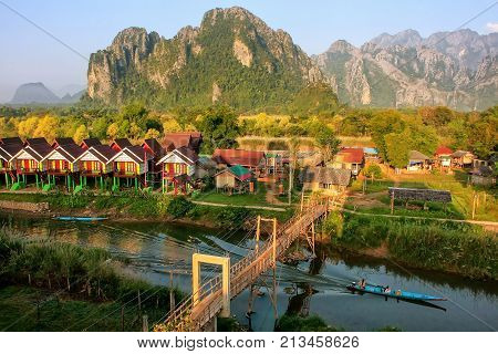 Row Of Tourist Bungalows Along Nam Song River In Vang Vieng, Vientiane Province, Laos