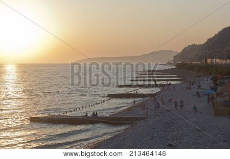 Dederkoy, Tuapse district, Krasnodar region, Russia - 6 July 2013: Sunset on the beach in Dederkoy
