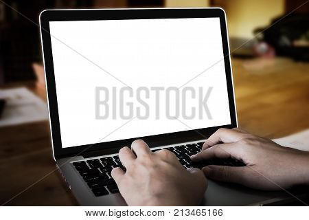 young man using laptop computer for online shopping. notebok with blank screen and can be add your texts or others.